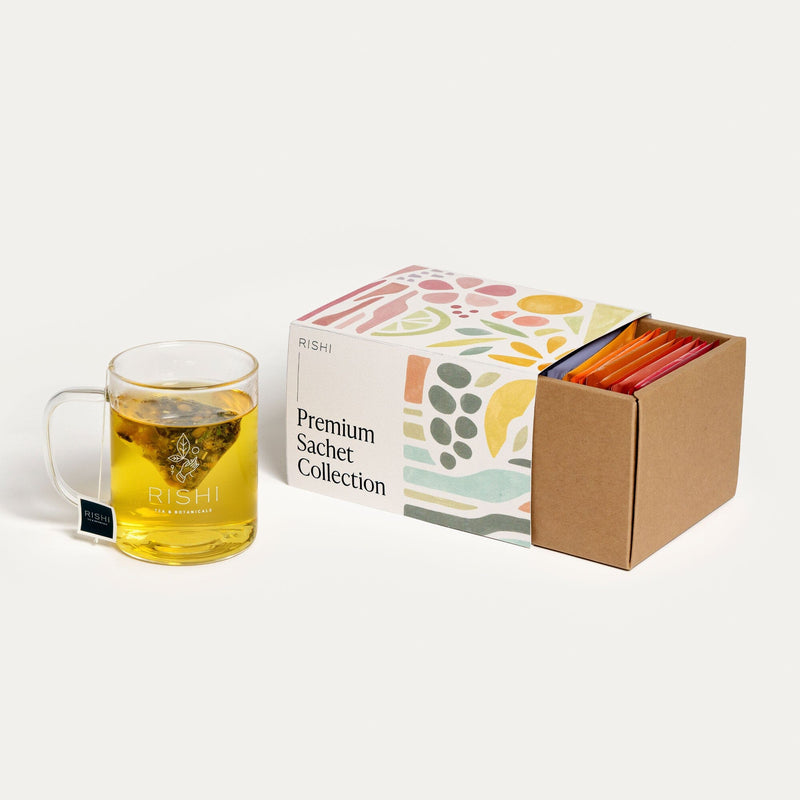 An ultimate experience of Premium Sachet Collection with a box next to it, showcasing a variety of flavors from Rishi Tea & Botanicals.